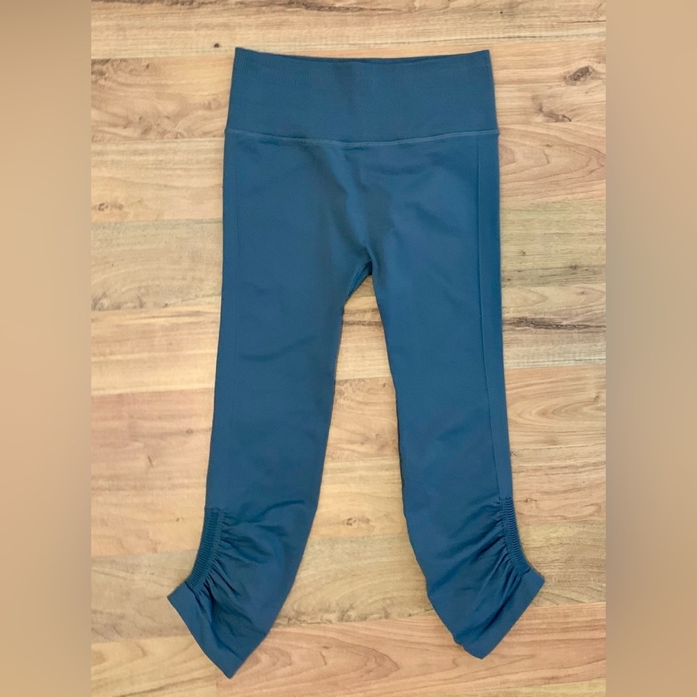 Dark gray Lululemon leggings with cinched leg, size 4